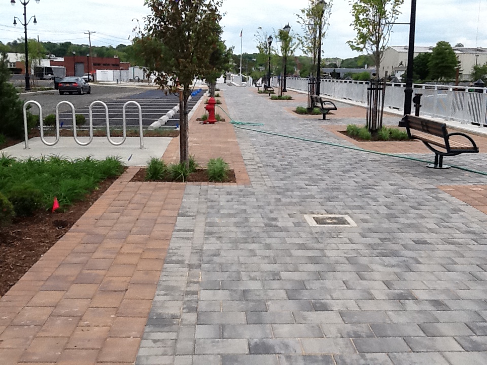 a view down the street with several benches and a fire hydrant