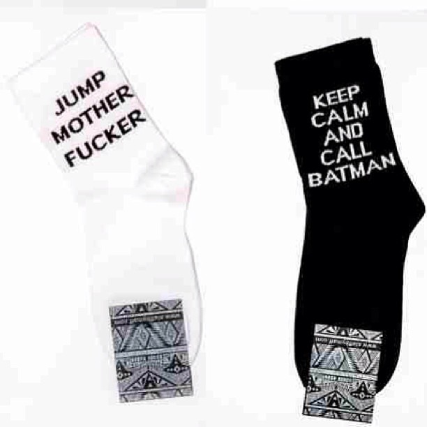a couple of socks with words on them