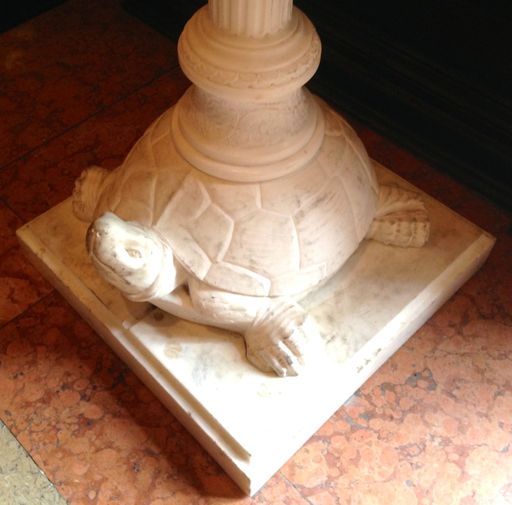 a statue of a turtle in a room