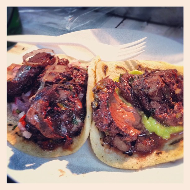 a plate of food with meat and some type of bread