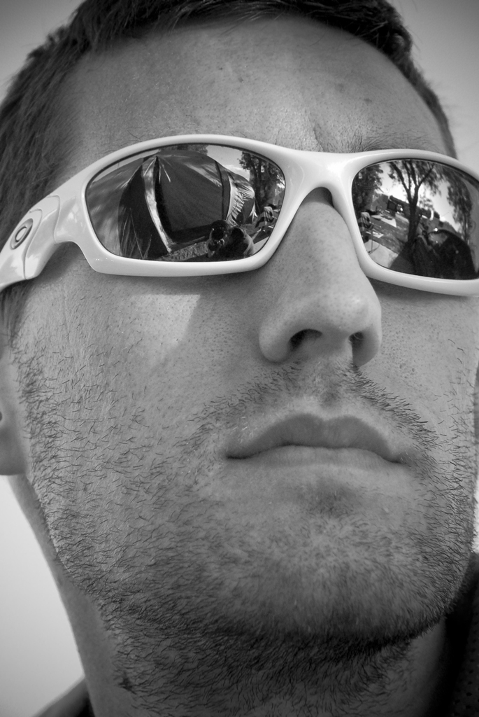 black and white pograph of man wearing sunglasses