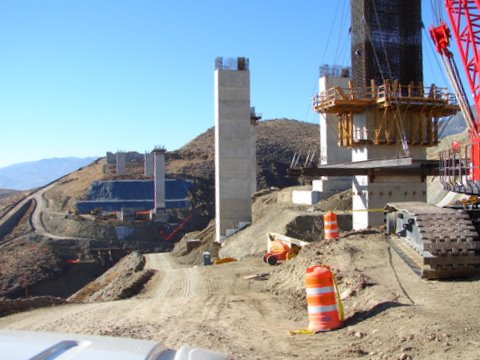 a crane and other machinery are around a construction site