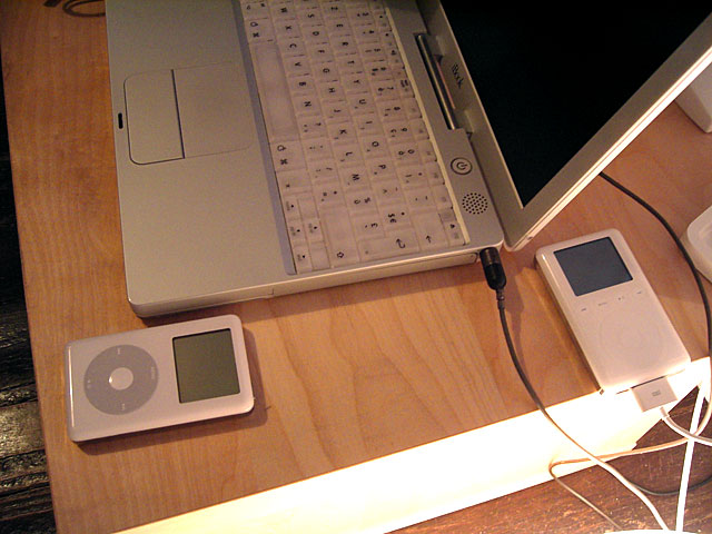 a laptop and other electronic devices sitting on a desk