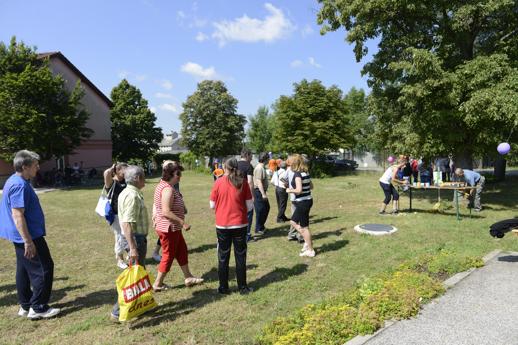 a group of people standing next to each other in a park