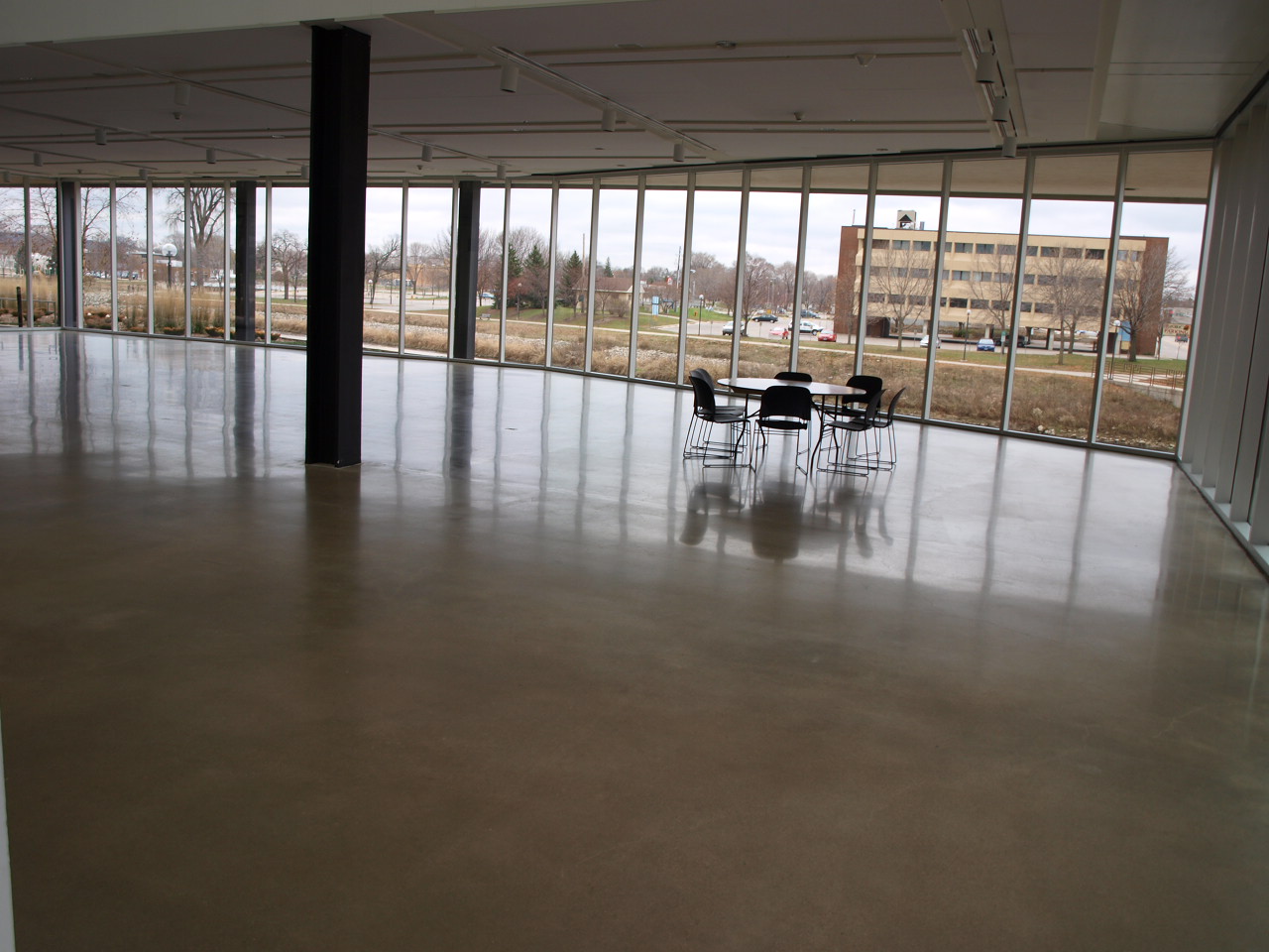 a dining room and a very big empty area