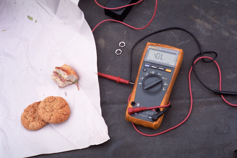 a pair of cookies on top of paper next to a digital thermometer