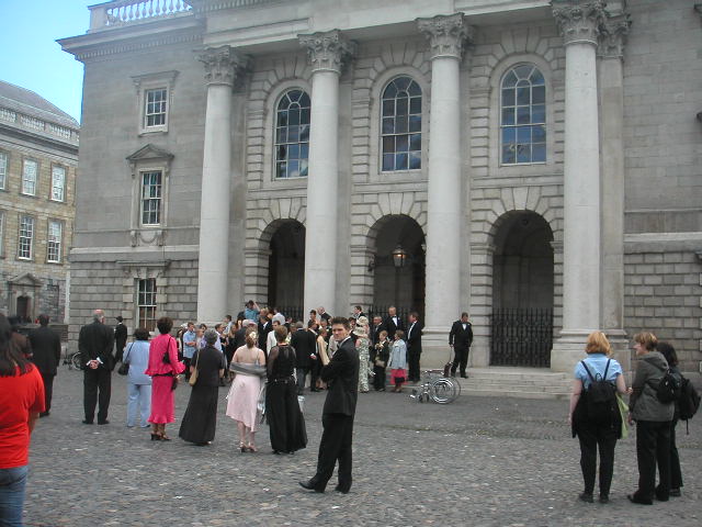 many people standing in front of a building