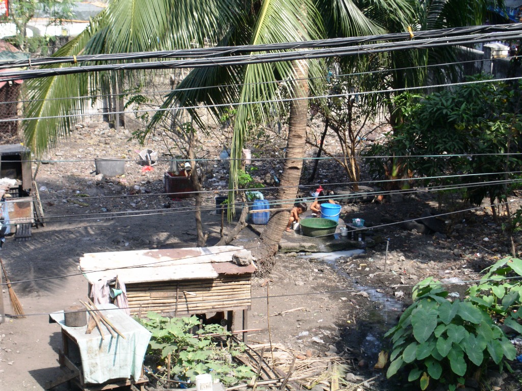 there is a yard full of trash and people sitting on chairs