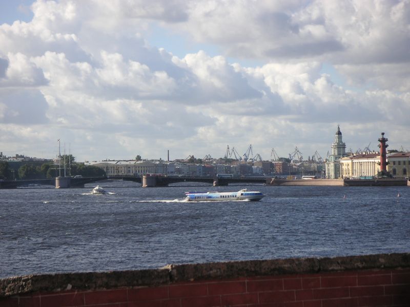 a view of a bridge, some houses and a water tower