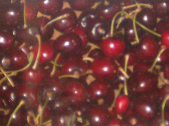 cherries are grouped together in an artistic po