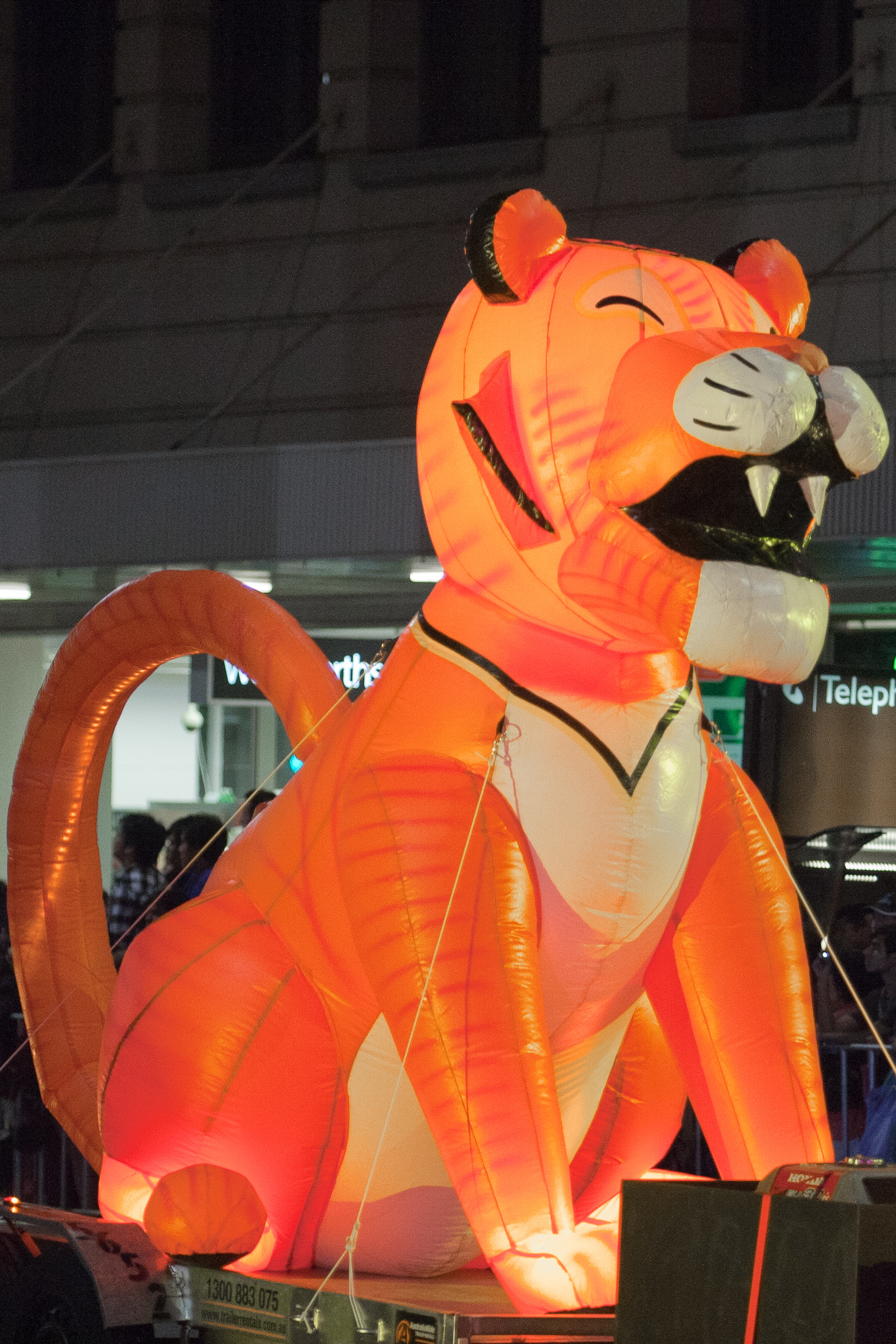 an inflatable orange cat sitting on a stage