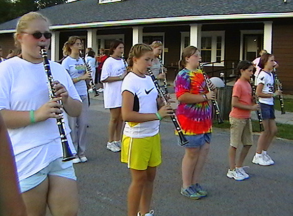 some people standing outside in different outfits