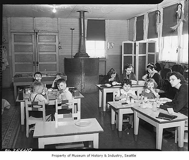 an old black and white po of children eating