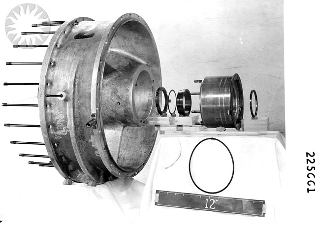 a metal wheel on display in black and white