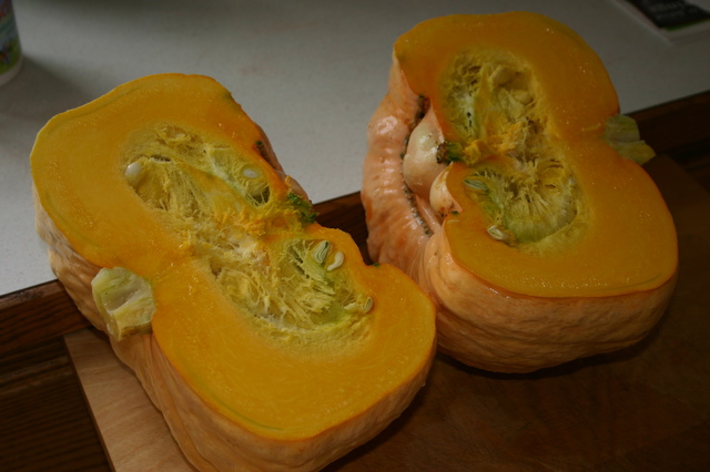 three halves of a squash with a whole squash inside