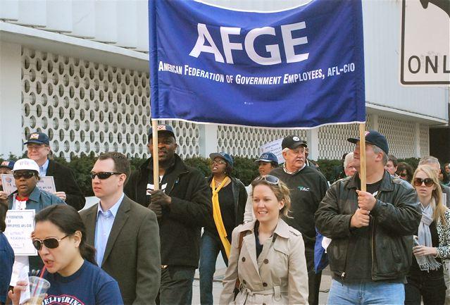 people standing and holding signs at a protest