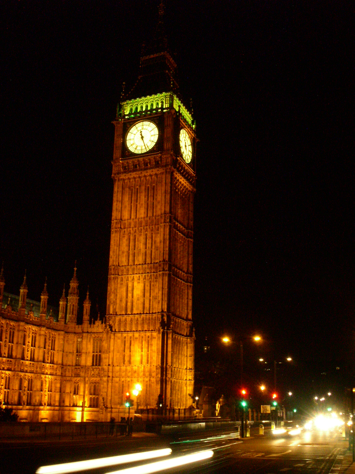 the big ben clock tower towering over a city at night