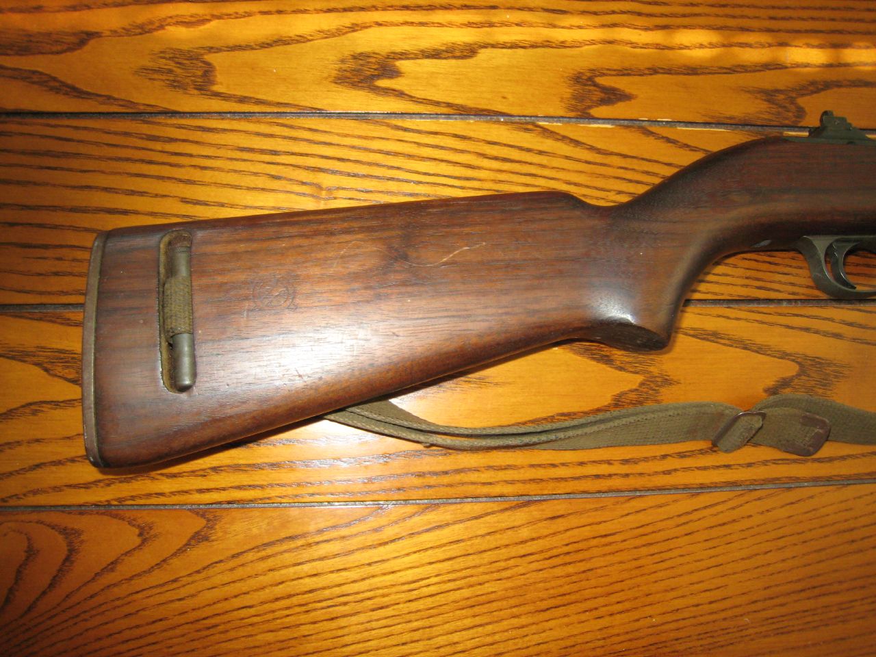 a rifle lying on top of a wooden table