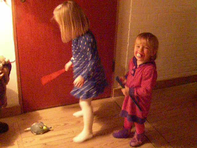 two little s playing with a wii mote