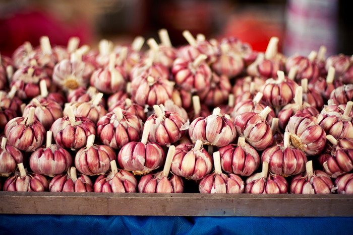 a closeup view of several bulbs of garlic