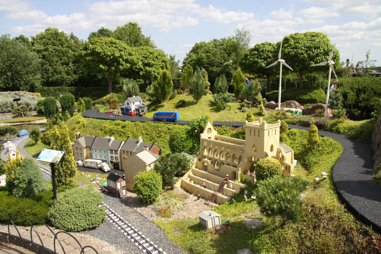 a model train set with a model railroad and buildings