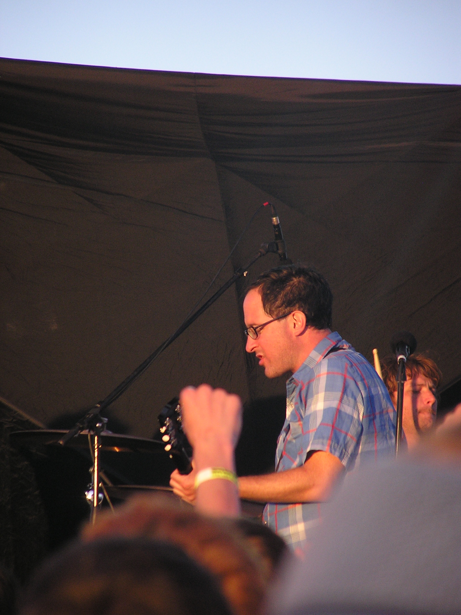 a band member performing with other people in front
