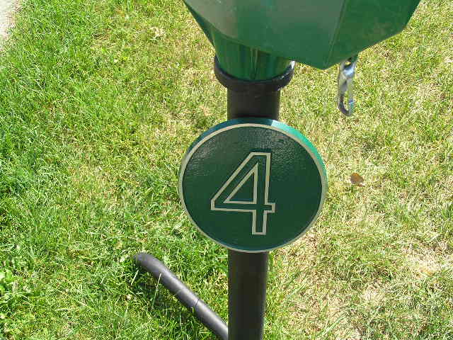 this is the number four and on the front of a green hydrant