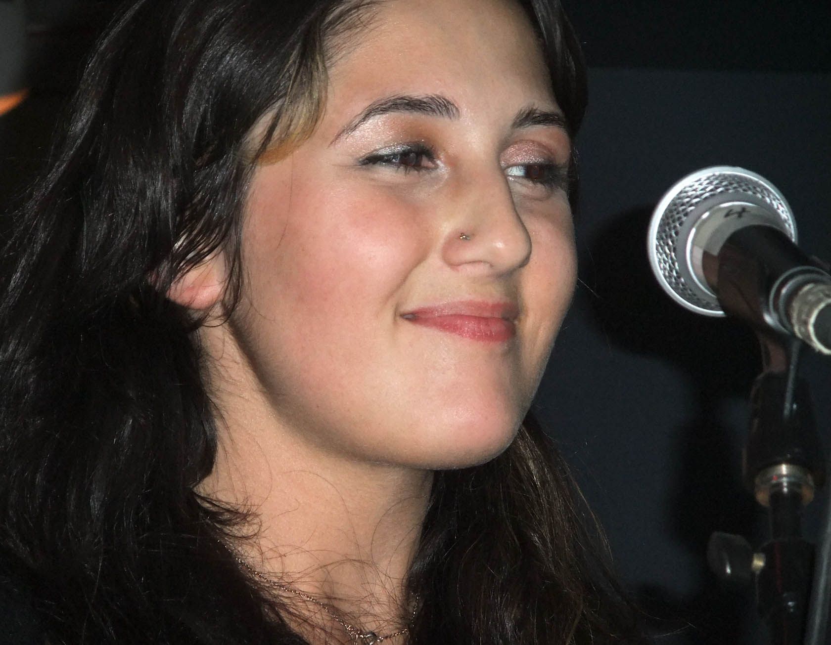 a close up of a person near a microphone