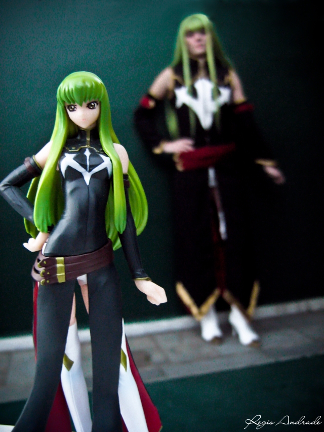 two action figures wearing green hair standing near each other