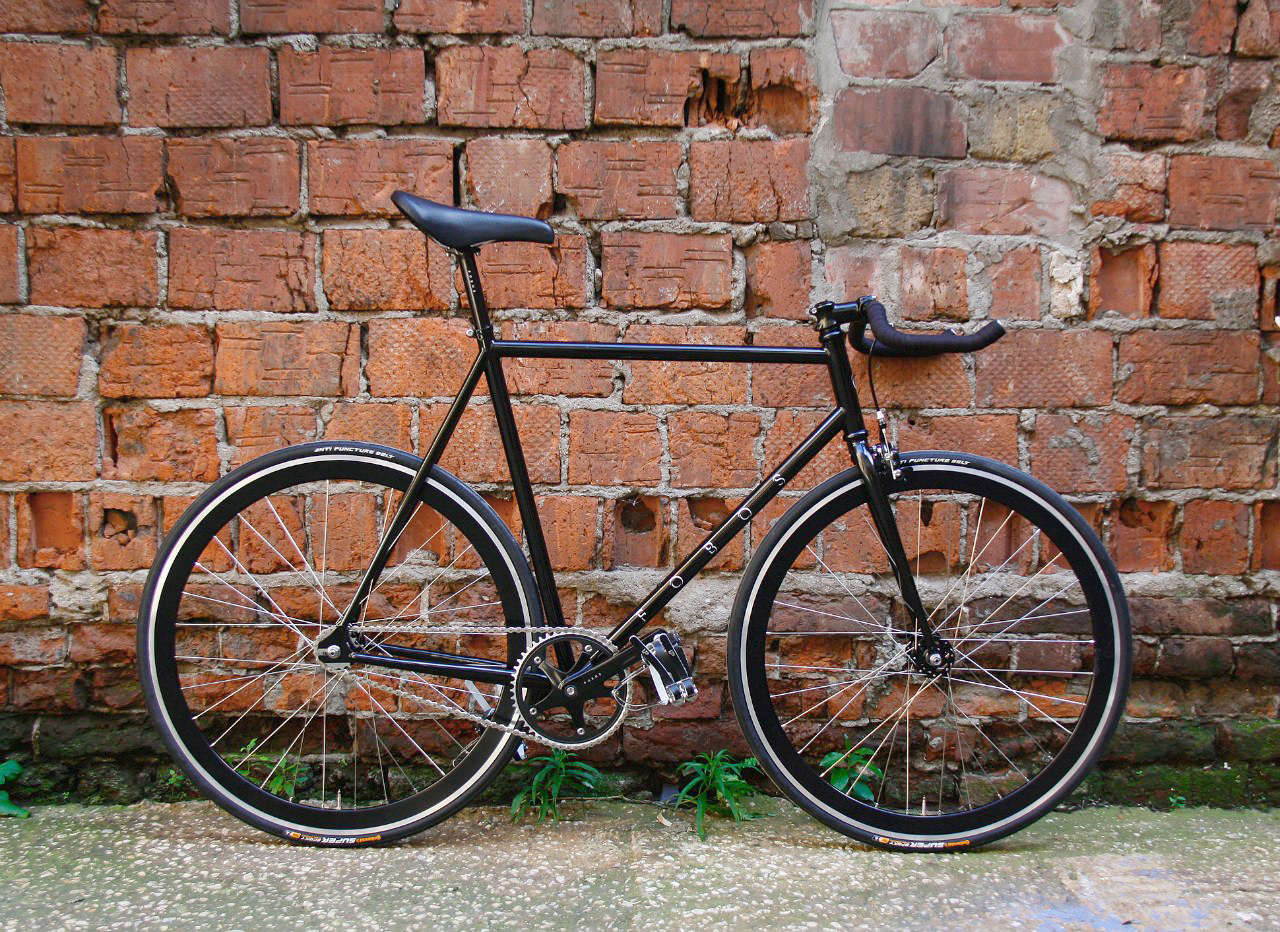 a bicycle is leaning up against a wall