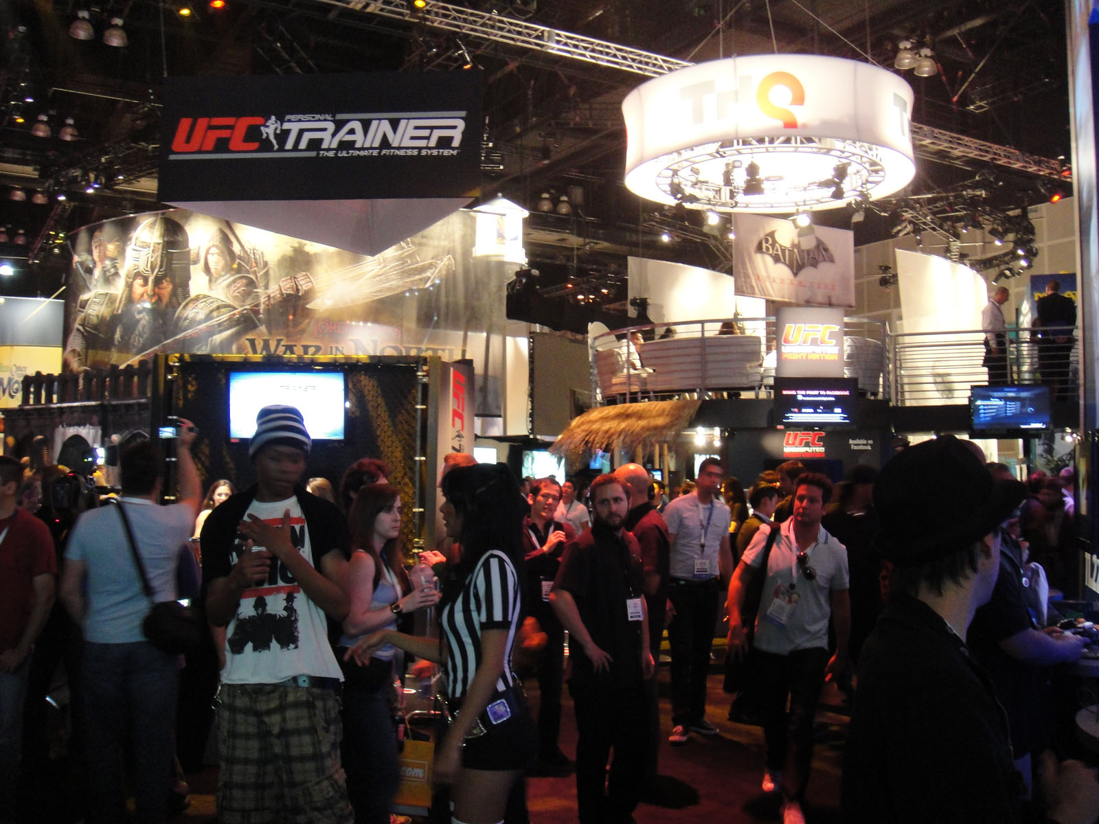people gathered around an exhibit of an upcoming game