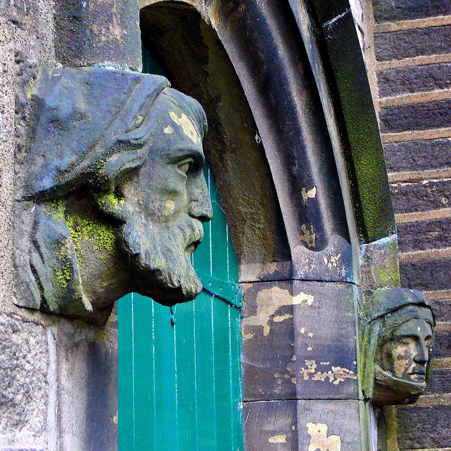 an image of a sculpture of a man's head on the side of a building