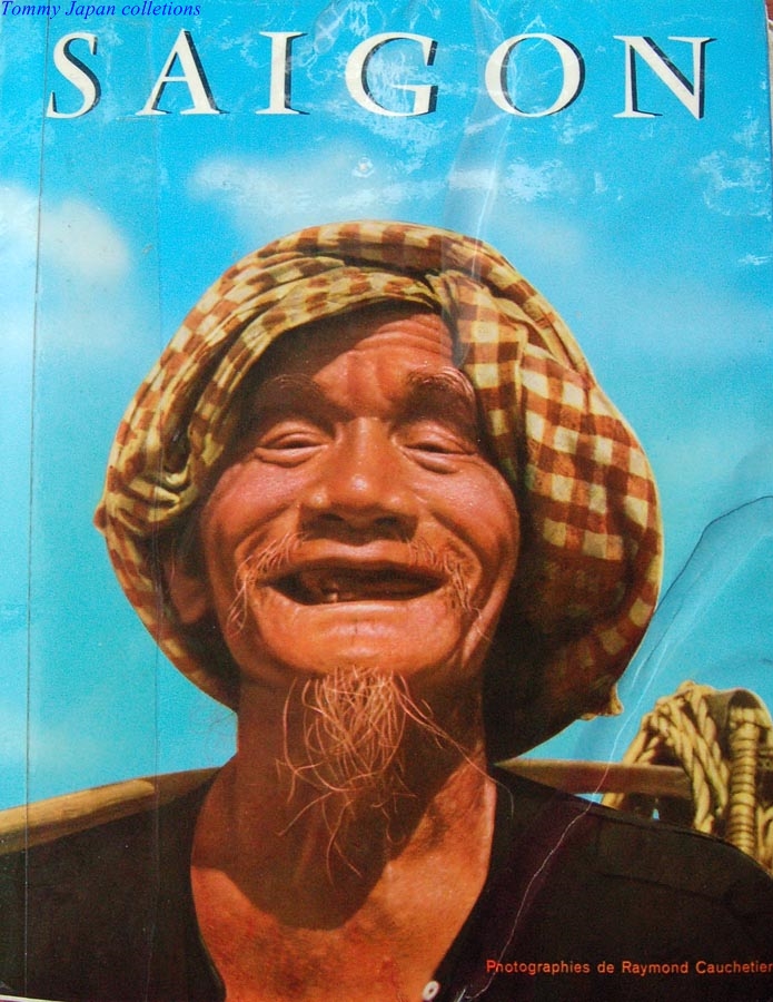 a book titled saigon with an image of a smiling person in front of a sky background