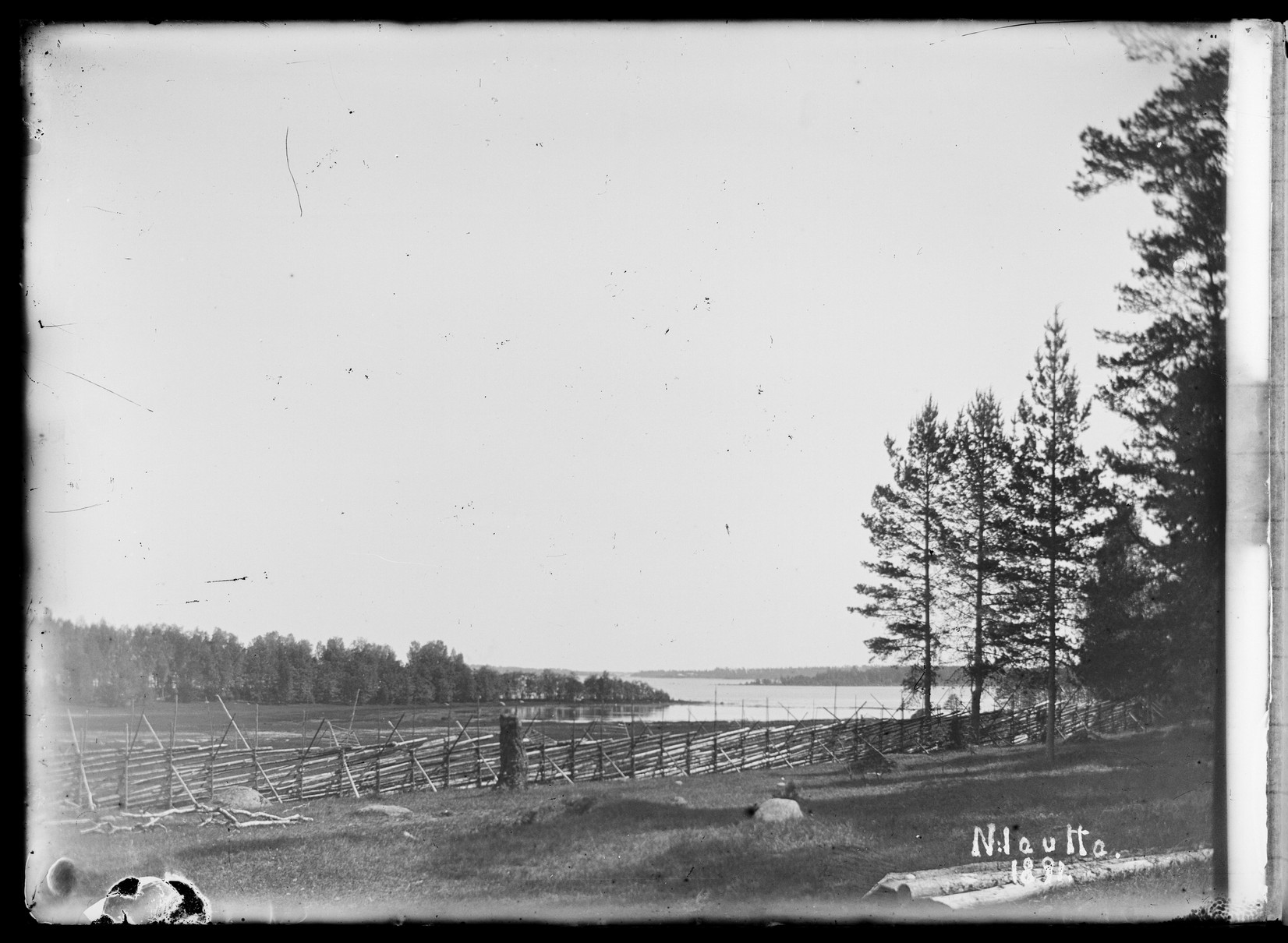 black and white pograph of a fenced area