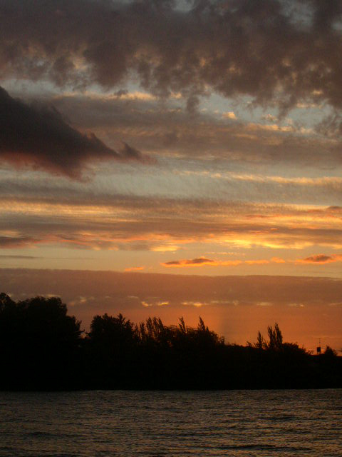 an image of a sunset on the water