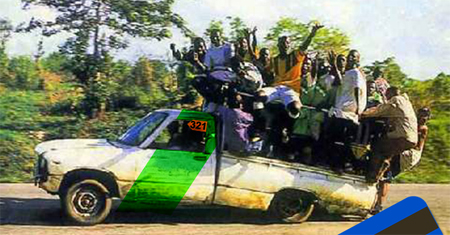 a car with several people on it traveling down a road