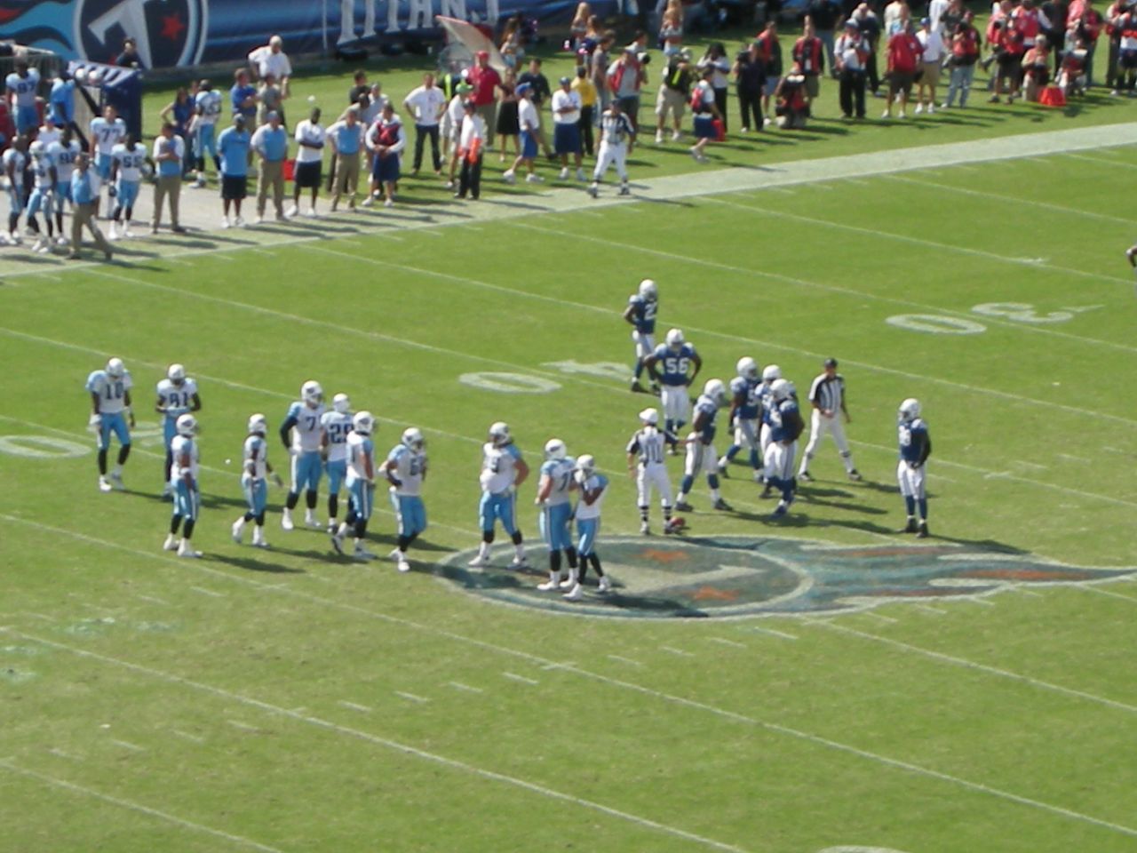 players stand and wait for the line up to play