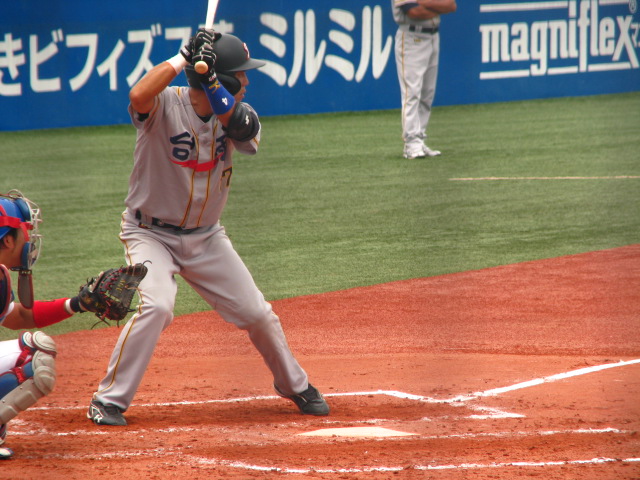 a baseball player taking a swing at the ball