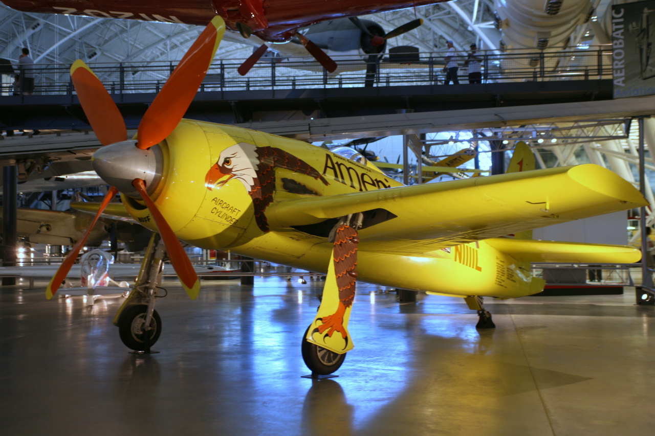 a yellow plane with propellers and some orange blades
