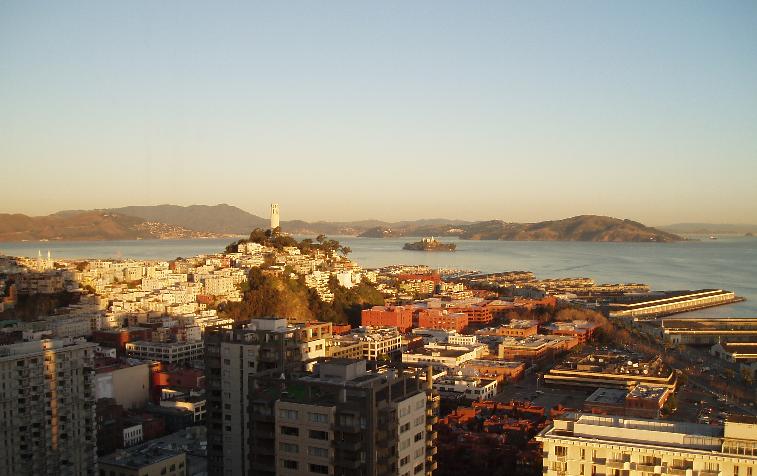 the view from a high building of an island with lots of buildings