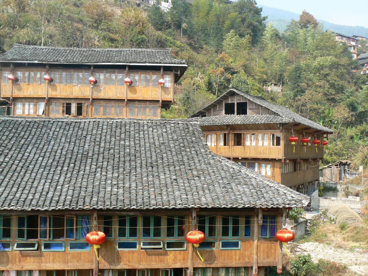 a house with chinese ornaments around the front windows