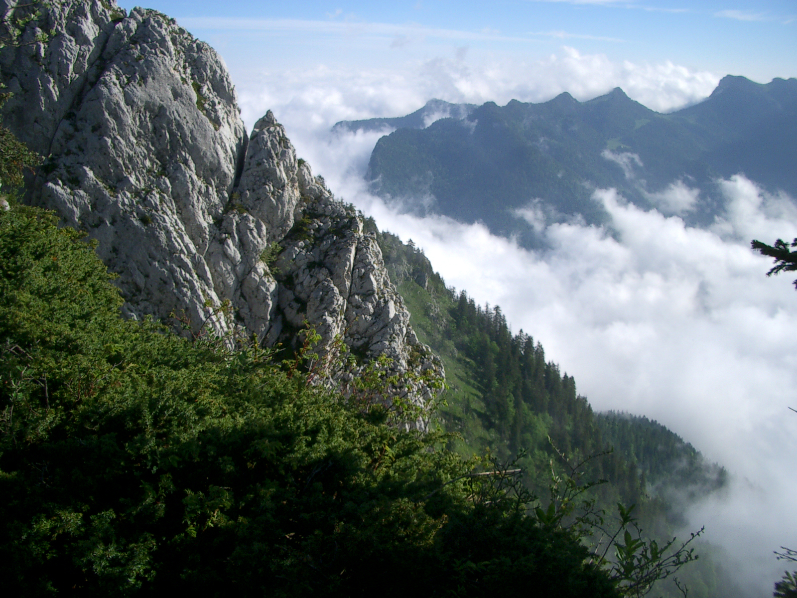 the mountains with low clouds and very steep cliffs