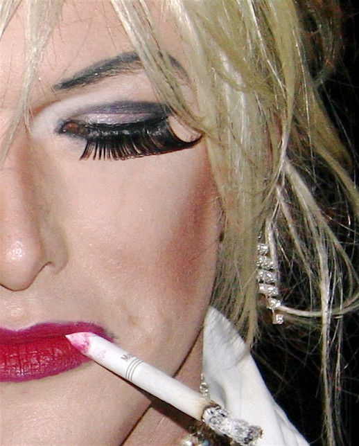 lady with makeup wearing white shirt and red lipstick holding a cigarette