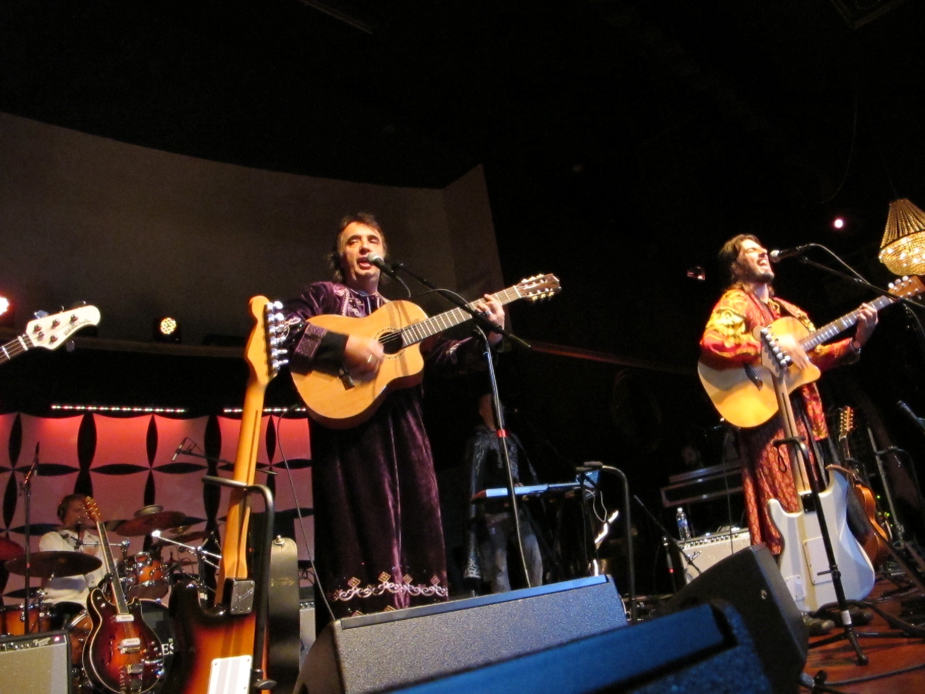 a group of people playing instruments on stage