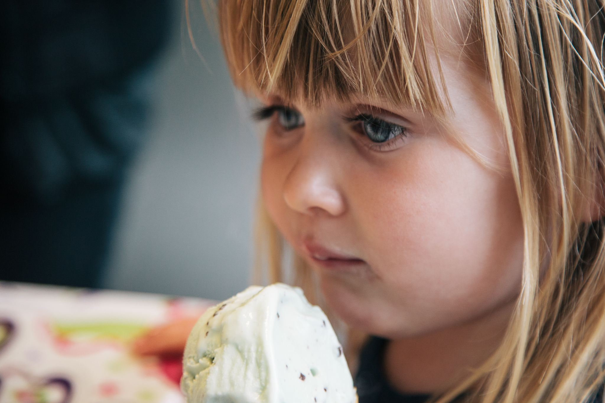  holding a large doughnut in her hand