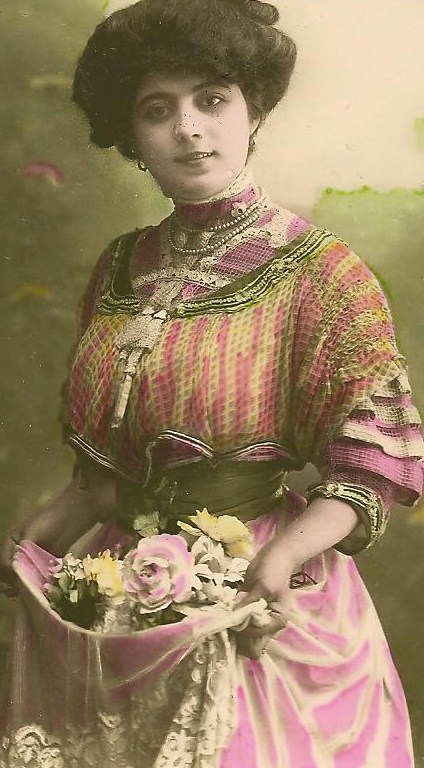 a woman in a dress holding a bouquet of flowers