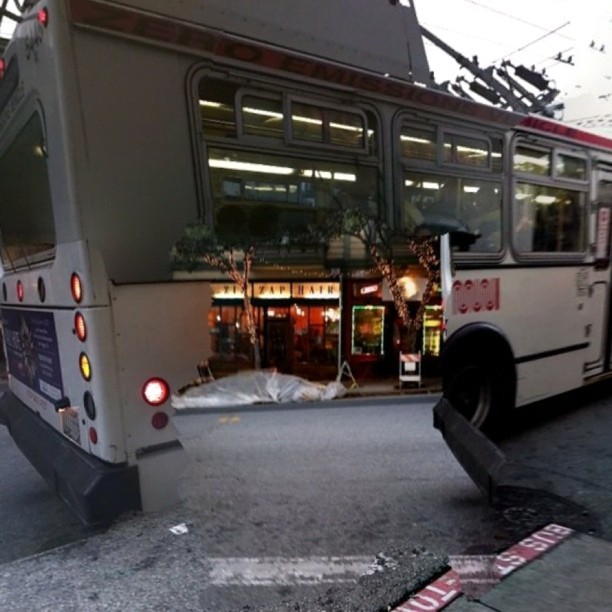 the front end of a bus in the street