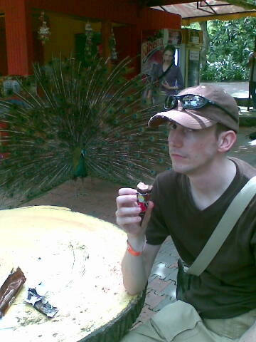 a young man in sunglasses smoking an electronic cigarette