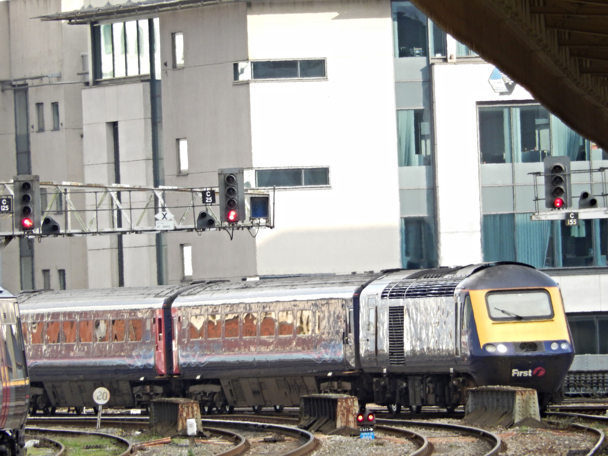 a train is moving along the train tracks