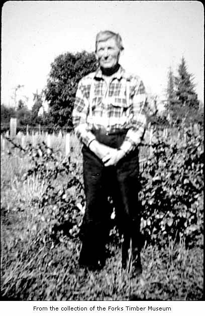 a man standing in a field of tall grass